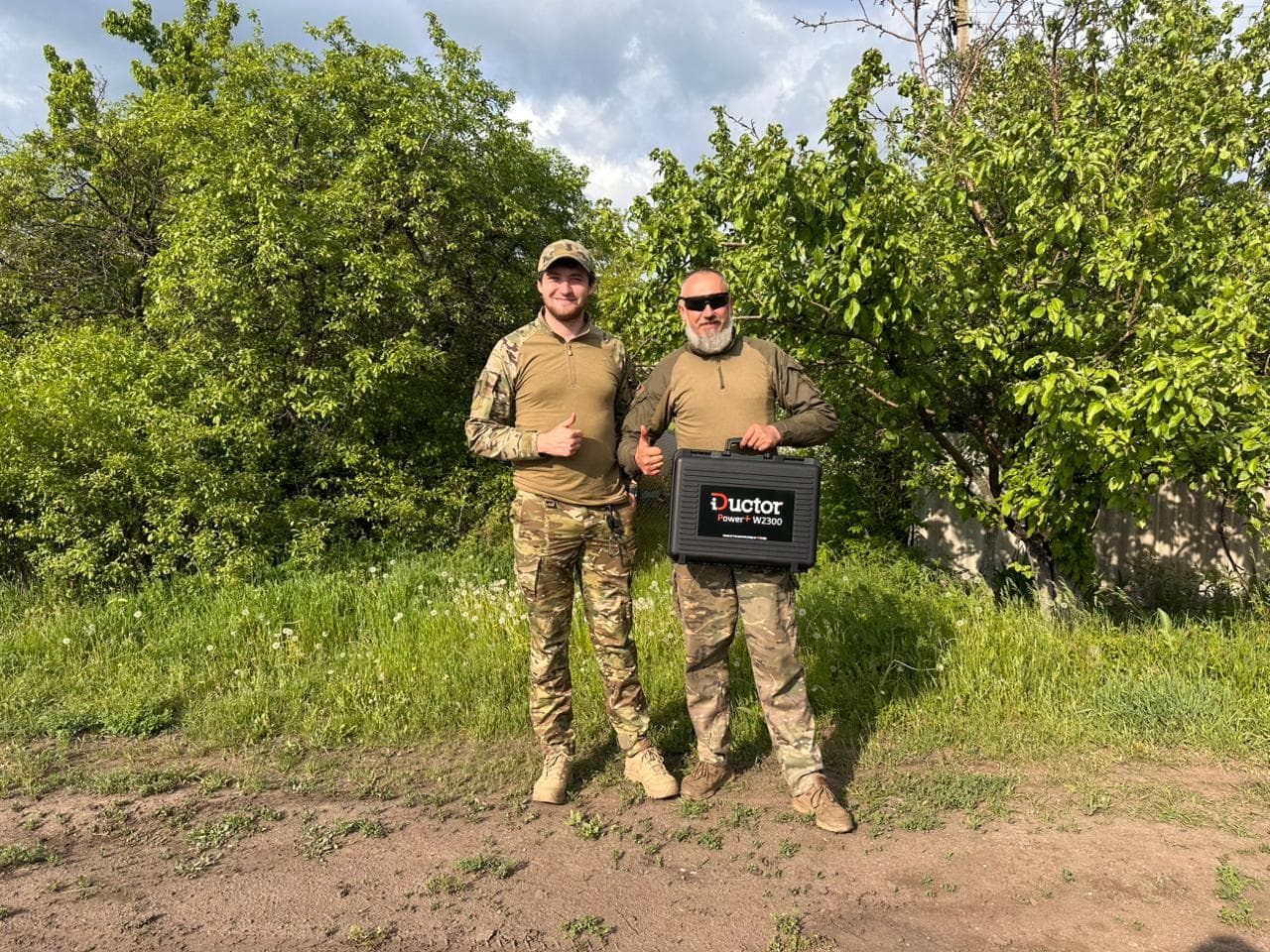 Repair team members holding a delivered tool case